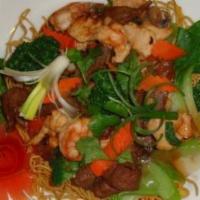 X6. House Special (Birds Nest Crispy Egg Noodles/Mì Xào giòn) · Crispy egg noodles birds nest topped with beef, chicken, calamari, prawns, and mixed seasona...