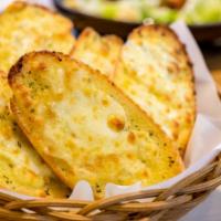 Cheesy Garlic Bread · Delicious warm garlic bread with cheese on top.