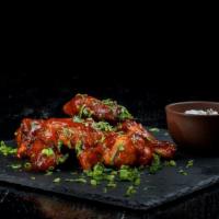 Hot Traditional Wings · Delicious cooked wings coated in hot sauce and Seasoned to perfection.