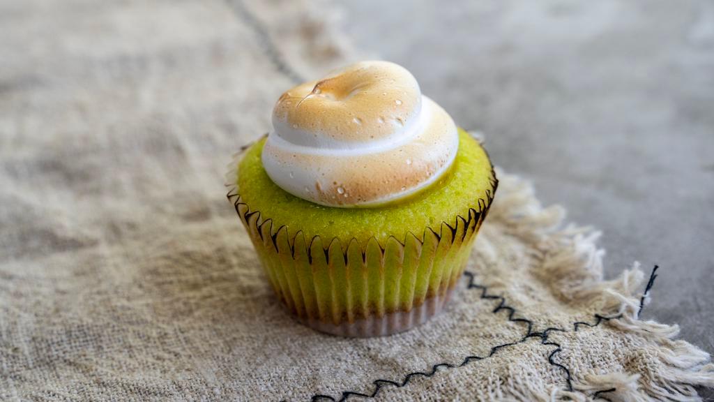 Key Lime (Mini Size) · Lime Cupcake with a Graham Cracker Crust, filled with Lime Curd, and topped with toasted Meringue frosting.