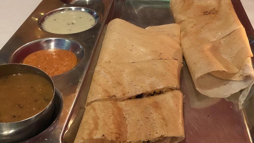 Paneer Dosa · Fermented rice and lentil crepe with cottage cheese and spices.