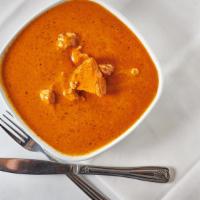 Chicken Tikka Masala · Clay oven baked organic chicken breast marinated in yogurt, garlic and spices served with to...