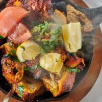 Tandoori Mix Platter · Mixed grill marinated in yogurt, lime juice, lea pepper sauce with chef's spices cooked in c...