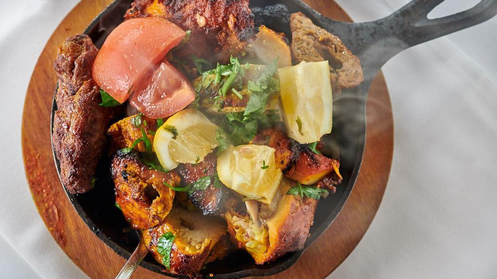 Tandoori Mix Platter · Mixed grill marinated in yogurt, lime juice, lea pepper sauce with chef's spices cooked in clay oven.