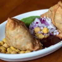 Samosa · Fried Pastry shells stuffed with spicy potatoes, served with chutney.