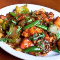 Chili Chicken · Boneless battered pieces of chicken stir-fried with bell peppers, onions and tomatoes.