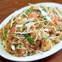 Vegetable Biryani · Fragrant rice cooked with fresh garden vegetables and nuts.