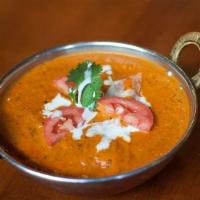 Chicken Tikka Masala · Diced tandoori chicken cooked in a creamy sauce, with tomatoes and spices.