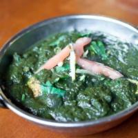 Saag Paneer · Cubes of cottage cheese cooked in a spinach curry.