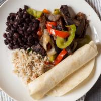 Flagstaff Fajitas · Sautéed chicken or steak, bell peppers and onions served with black beans, rice, sour cream ...