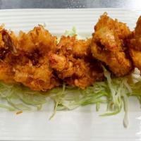 Coconut Shrimps · Deep-fried batter butterfly shrimp coated with shredded coconut served with sweet chili sauce.