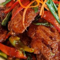 Spicy Wings · Deep-fried wings and sautéed with chili homemade sauce.