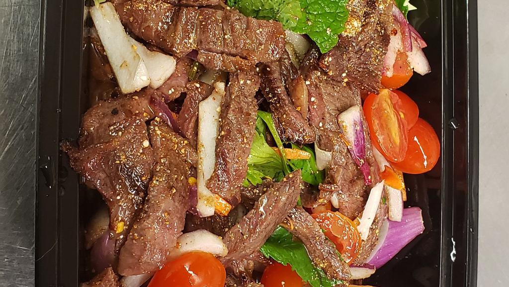 Beef Salad · Grilled beef with Thai herbs in spicy lime dressing.