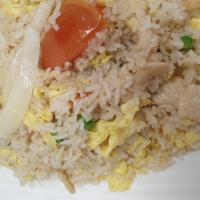 Classic Fried Rice · Jasmine rice pan-fried with choice of meat, garlic, egg, yellow onion, tomato, peas, and car...