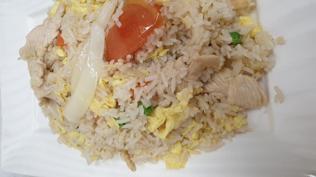 Classic Fried Rice · Jasmine rice pan-fried with choice of meat, garlic, egg, yellow onion, tomato, peas, and carrot.
