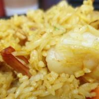 Pineapple Fried Rice · Jasmine rice pan-fried with garlic, egg, chicken, shrimp, pineapple, peas, yellow onion, car...