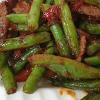 Pad Prik Khing · Choice of meat sautéed with sweet homemade curry paste, green bean, kaffir lime leaves, and ...