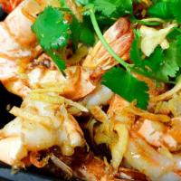 Tamarind Prawn · Jumbo prawns with the tangy flavor of tamarind sauce sprinkled with fried onion and cilantro.