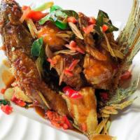 Knock out Fish · Fried whole Tilapia fish, served with sweet and chili sauce on the fish