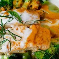 Choo Chee Salmon · Salmon fillet in Panang curry sauce with bell pepper, steamed veggies, and kaffir lime leaves.