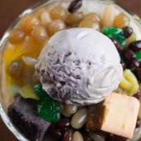 Halo Halo · Assorted candied fruits, mung beans and coconut strips. Topped with leech flan and purple ya...