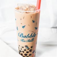 #1. House Milk Tea · House blended black tea with lactose-free milk and USA Grade A honey pearls.