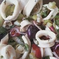 Calamari Salad · Marinated calamari in vinaigrette.