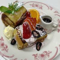 Pain De Mie Custardy French Toast (2 pcs) · Cottage sweet cream, berries and maple syrup.