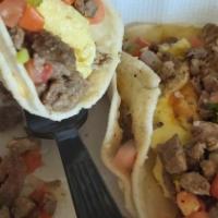 Carne Asada Breakfast Quesadilla · Breakfast quesadilla filled with carne asada, eggs, melted cheese, pico de gallo, and served...
