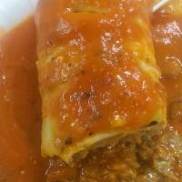 6. Super Wet Burrito · With meat, rice, beans, cheese, sour cream, guacamole, pico de gallo, enchilada sauce