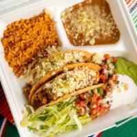 18. Crispy Taco Plate · Two crispy tacos with choice of meat