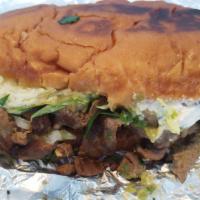 23. Torta · Bread, meal, retried beans, cilantro, onions, tomatilla sauce cheese, lettuce