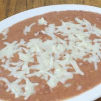 House Crafted  Bean Dip  with Melted Cheese · Dip with housemade chips. Serves 3-5 persons.