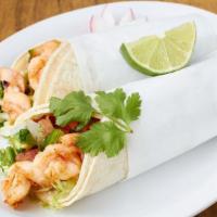 Grilled Salmon Seafood Burrito · With rice, beans and salsa.