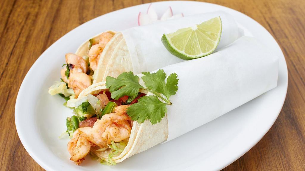 Grilled Salmon Seafood Burrito · With rice, beans and salsa.