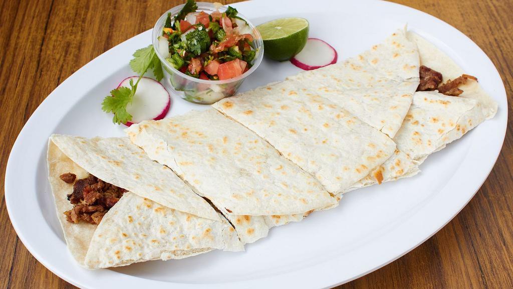 Quesadilla Suiza · Quesadilla with cheese, choice of meat and salsa. Make it super by adding cheese, guacamole, sour cream, lettuce and tomato; or make it a dinner by adding rice, beans, salad, and tortillas.