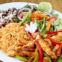 Carne Asada Steak Dinner · Flame broiled steak with rice, beans, salad and tortillas.