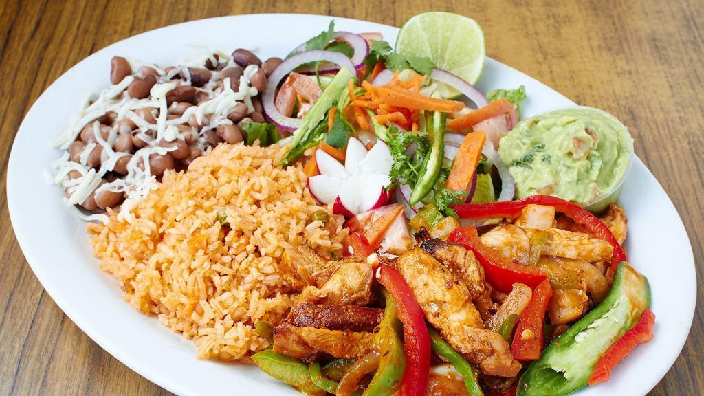 Carne Asada Steak Dinner · Flame broiled steak with rice, beans, salad and tortillas.