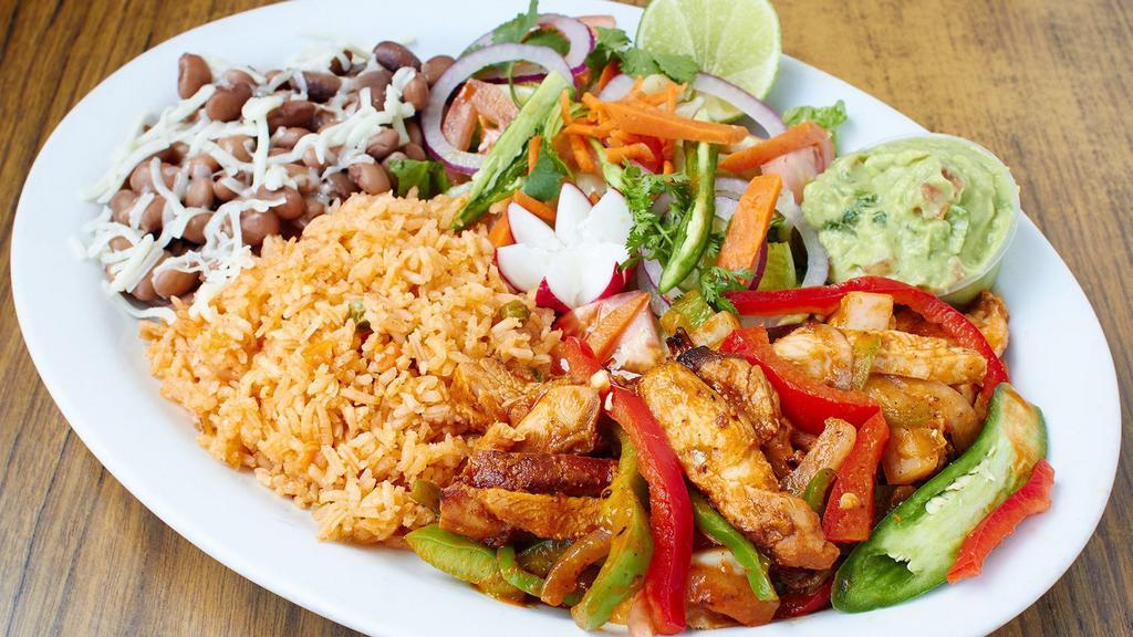 Pollo Asado Dinner Meal · Flame Broiled chicken with rice, beans, salad and tortillas.