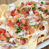 Meat Nachos · House Made Corn Chips,, beans, cheese, Choice of meat and salsa. Make it super by adding che...