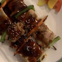 Yakitori · Grilled chicken and vegetables on two skewers.