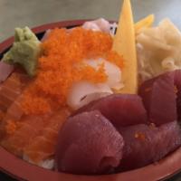 Chirashi Sushi · Twelve pcs of assorted sashimi and pickled veggie over sushi rice.