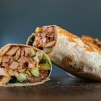 Chicken Shawarma Wrap · All natural raised chicken cooked on a vertical rotisserie served in a fresh lavash wrap, ho...
