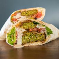 Falafel Wrap · Daily made falafel mix served on lavash with hummus, spring mix, tomatoes, pickles and tahin...