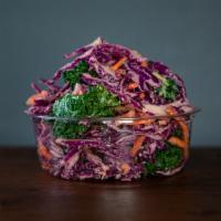 Kale-Slaw · Red cabbage kale carrots. dressed with house caesar dressing. contains dairy.