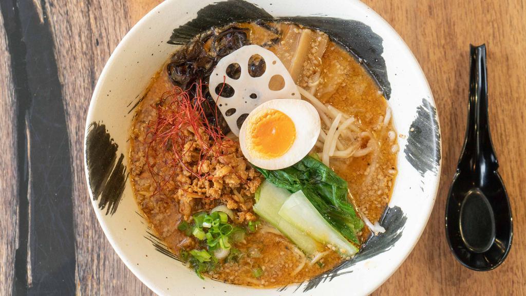 Tantanmen · Topped with spicy ground pork, soft-boiled egg, lotus root, seasoned bamboo shoot, kikurage mushroom, bokchoy, bean sprouts, tokyo leek and dried chili strings, our creamy sesame-based tonkotsu soup is a must-try for those who love a little spice.