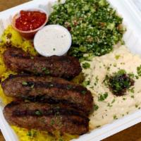 Kefta Kabab Plate · Kefta with rice, seasoned onions, grilled tomatoes,  tabouli, hummus (substitute with any ot...