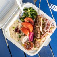 Lamb Kabab Plate · Lamb with rice, seasoned onions, grilled tomatoes, tabouli, hummus (substitute with any othe...