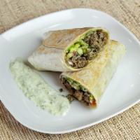 Kufta Kebab Wrap · Wrap filled with our tender beef kebab, tahini sauce, grilled tomatoes, and onions.