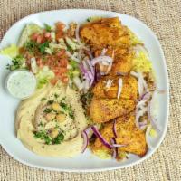Shish Kebab Plate · Our shish kebab plate is served with our tender pieces of chicken or beef kebab, rice, hummu...